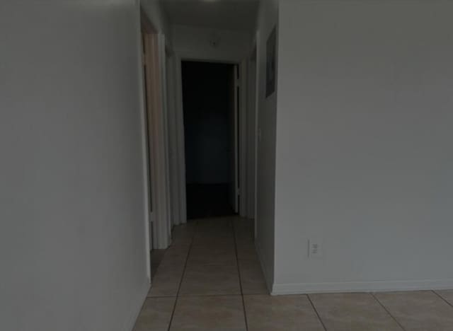 hall with light tile patterned flooring