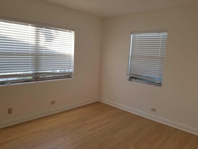 unfurnished room featuring light wood-type flooring