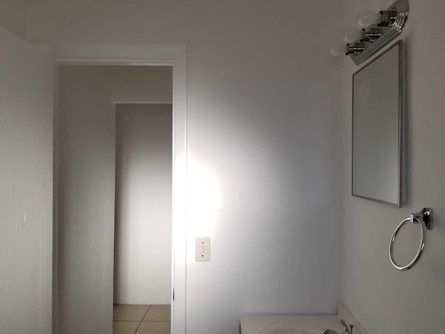 bathroom with tile patterned floors