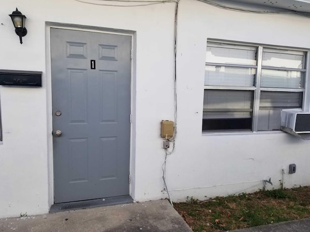 property entrance featuring cooling unit