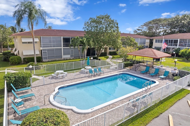 view of swimming pool with a gazebo and a patio area