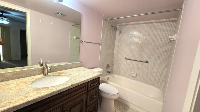 full bathroom with tile patterned flooring, vanity, toilet, and tiled shower / bath