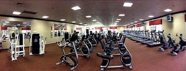 exercise room featuring a paneled ceiling