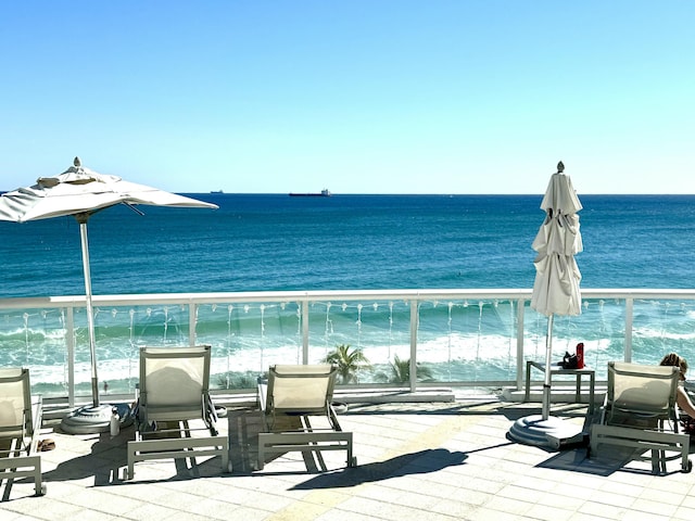 balcony featuring a water view