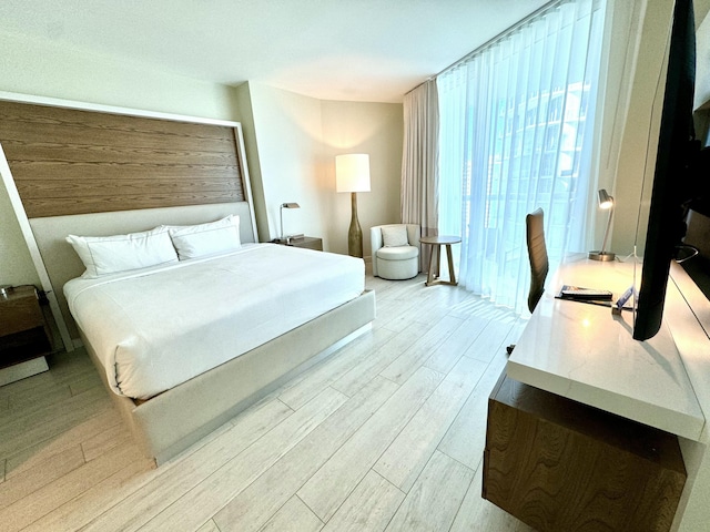 bedroom featuring light wood-type flooring