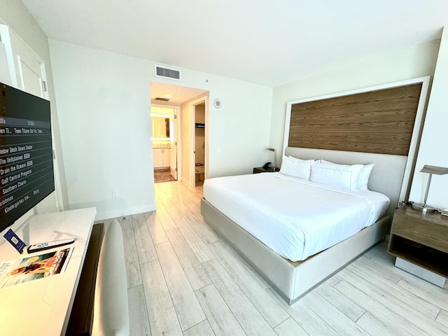 bedroom featuring light wood-type flooring