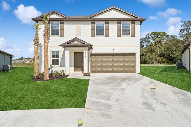 view of front of house featuring cooling unit, a garage, and a front yard