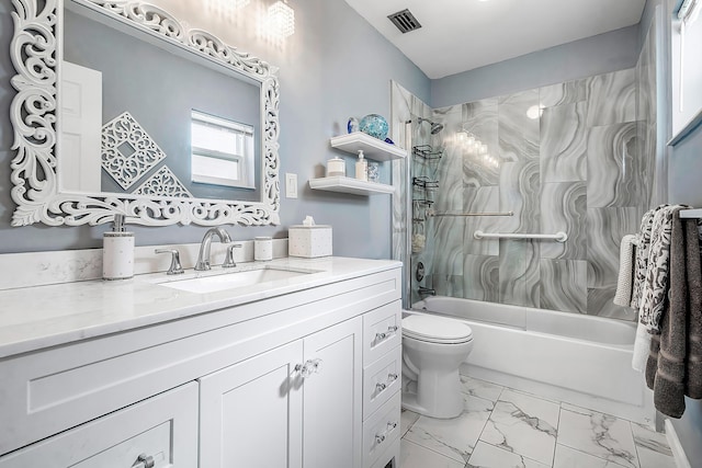 full bathroom with vanity, toilet, and tiled shower / bath