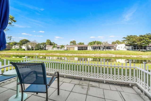 view of patio with a water view