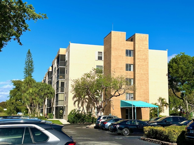 5280 NW 2nd Ave Unit 314, Boca Raton, FL 33487 - view of apartment building / complex with uncovered parking