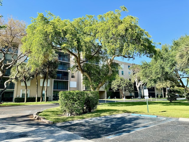 5280 NW 2nd Ave Unit 314, Boca Raton, FL 33487 - view of building exterior featuring uncovered parking