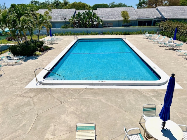 view of pool featuring a patio