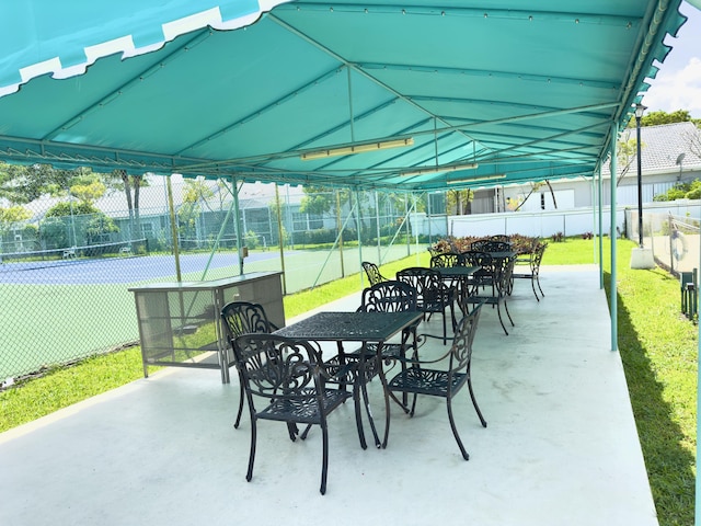 view of patio featuring tennis court