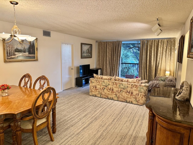 carpeted dining room with a textured ceiling and a notable chandelier