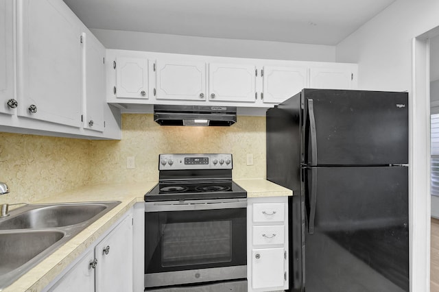 kitchen featuring black fridge, ventilation hood, sink, electric range, and white cabinetry