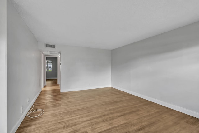 spare room featuring light hardwood / wood-style floors