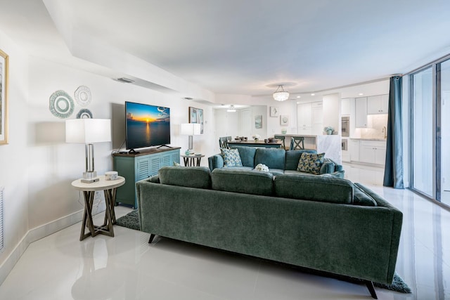 living room with light tile patterned floors