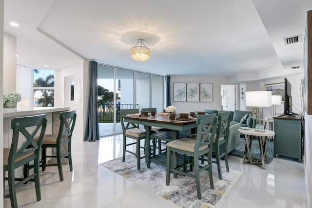 dining area with a wall of windows