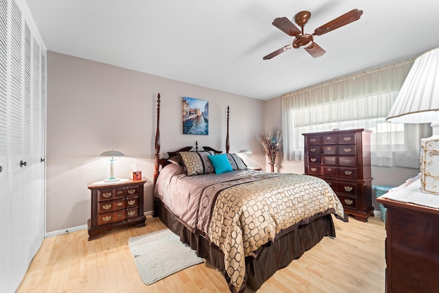 bedroom featuring a closet, light hardwood / wood-style flooring, and ceiling fan