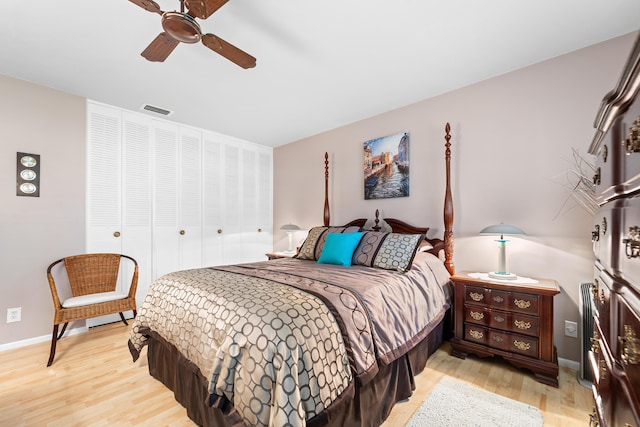 bedroom with a closet, ceiling fan, and light hardwood / wood-style flooring