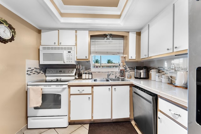 kitchen featuring sink, tasteful backsplash, white appliances, white cabinets, and ornamental molding