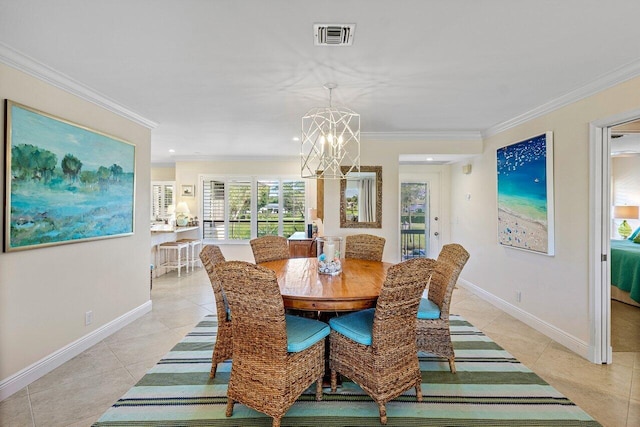 dining room with a chandelier, ornamental molding, and light tile patterned flooring