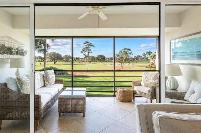 sunroom featuring a wealth of natural light and ceiling fan