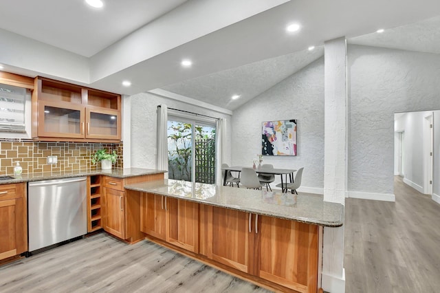 kitchen with light stone countertops, glass insert cabinets, brown cabinetry, and stainless steel dishwasher