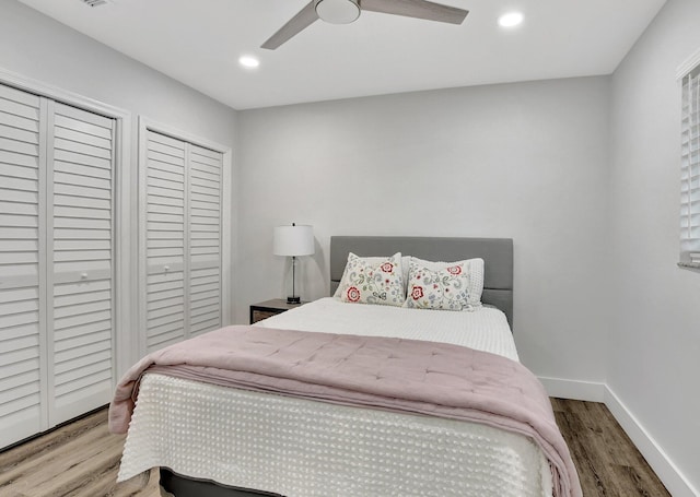 bedroom featuring a ceiling fan, baseboards, wood finished floors, and recessed lighting