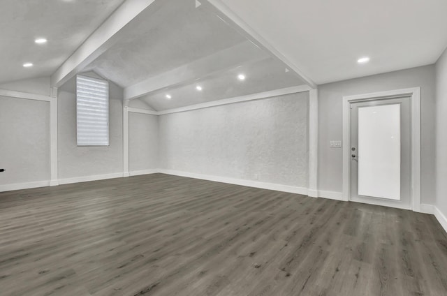 additional living space featuring dark hardwood / wood-style flooring and lofted ceiling