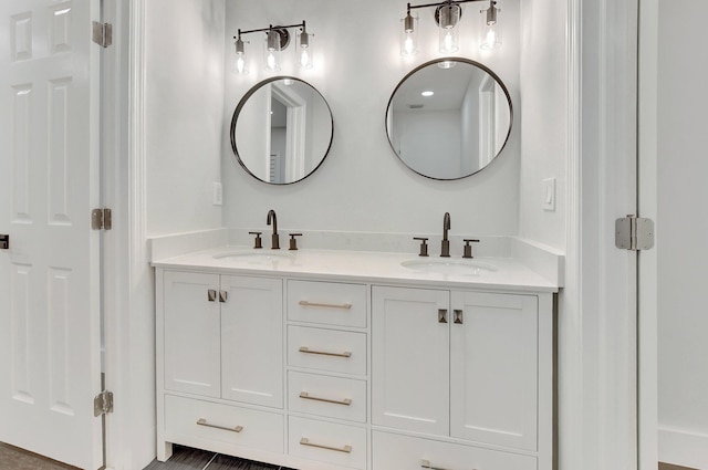 bathroom with double vanity and a sink