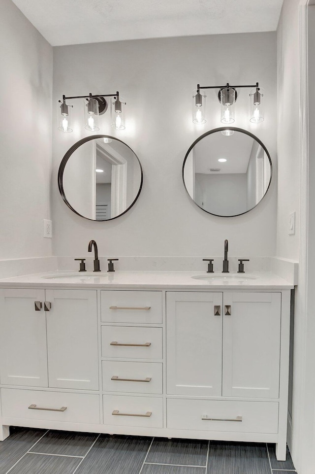 bathroom with double vanity and a sink