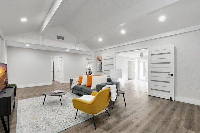 living room featuring high vaulted ceiling, beam ceiling, and hardwood / wood-style floors