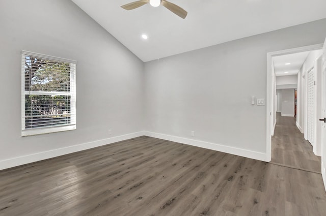 spare room featuring high vaulted ceiling, ceiling fan, and dark hardwood / wood-style floors