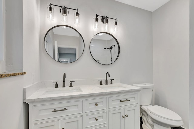 bathroom with toilet and vanity