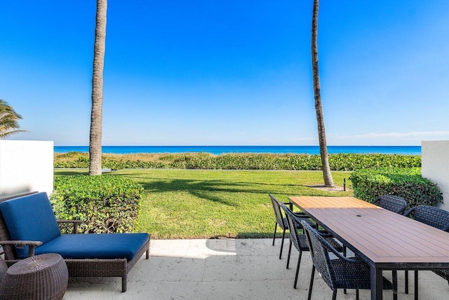 view of patio with a water view