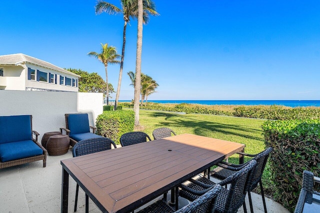 view of patio featuring a water view