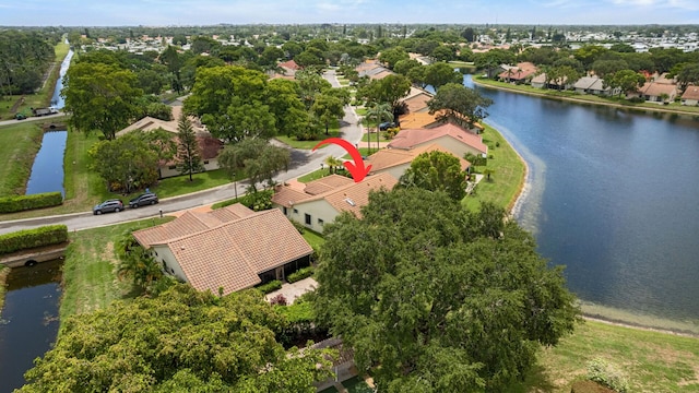 aerial view featuring a water view and a residential view