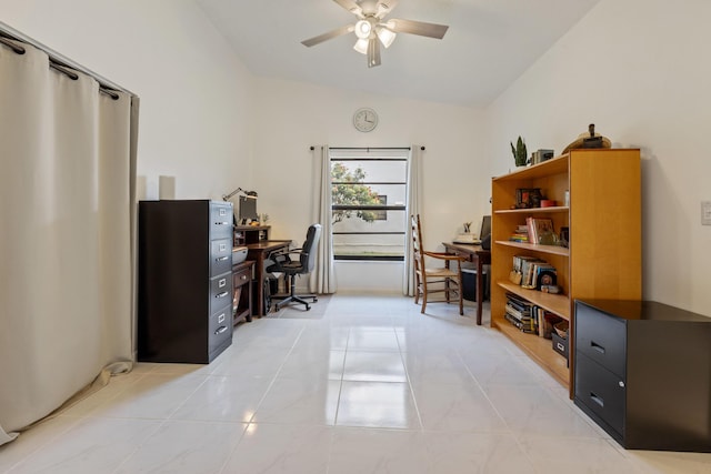 tiled home office featuring ceiling fan and lofted ceiling