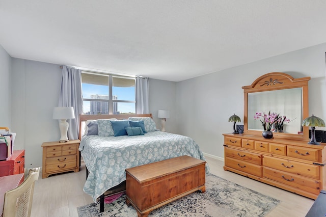 bedroom with light wood-type flooring