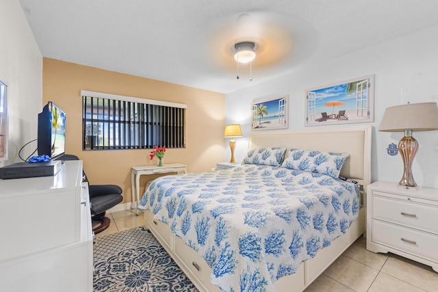 tiled bedroom with ceiling fan