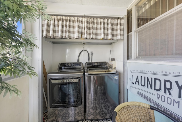 laundry area with laundry area and washing machine and clothes dryer