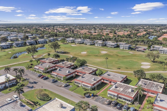 aerial view with view of golf course and a water view