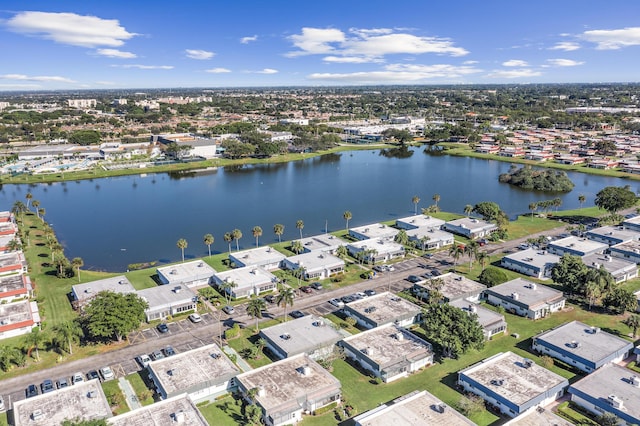 drone / aerial view featuring a residential view and a water view