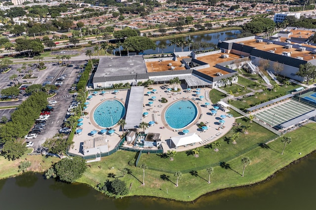 birds eye view of property featuring a water view