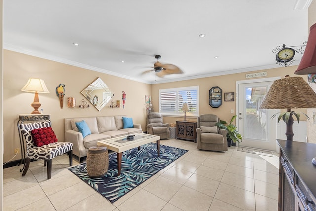 living room with ceiling fan, light tile patterned floors, and ornamental molding