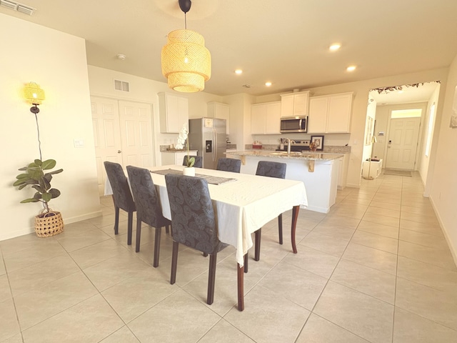 dining area featuring light tile patterned floors