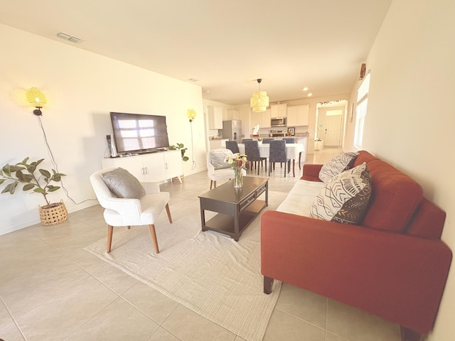 tiled living room featuring a healthy amount of sunlight