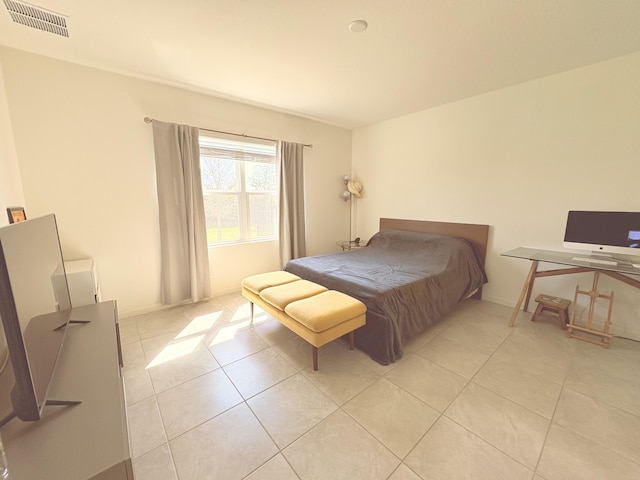 bedroom with light tile patterned flooring