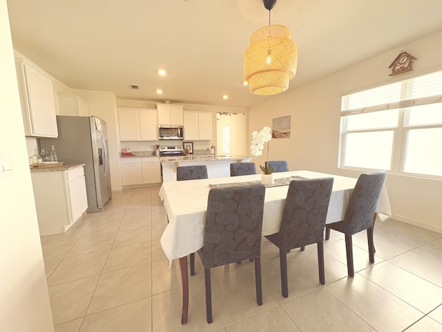 dining room with sink and light tile patterned floors